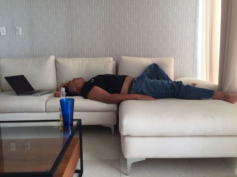 Asad Zulfahri sleeping on a couch