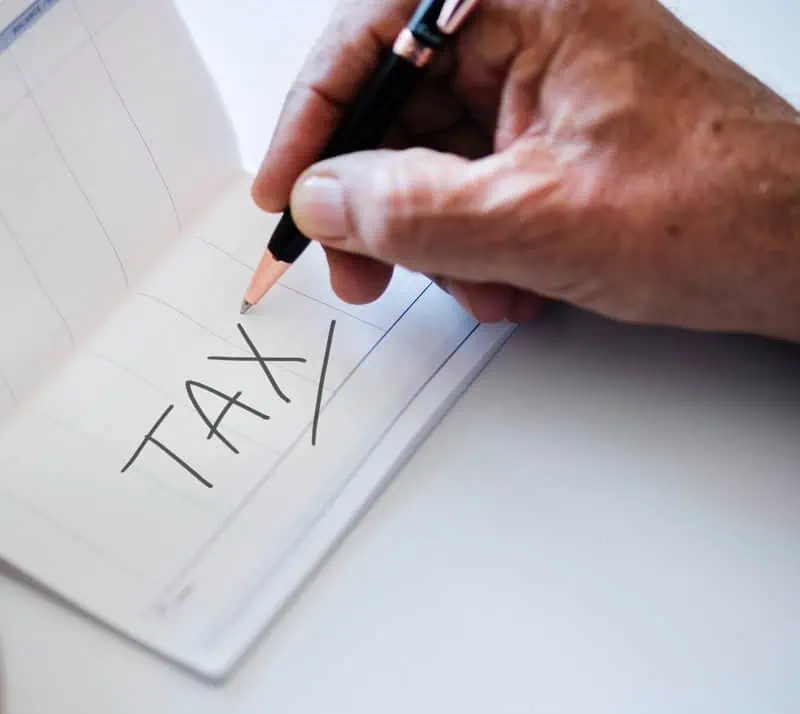Tax written on piece of paper